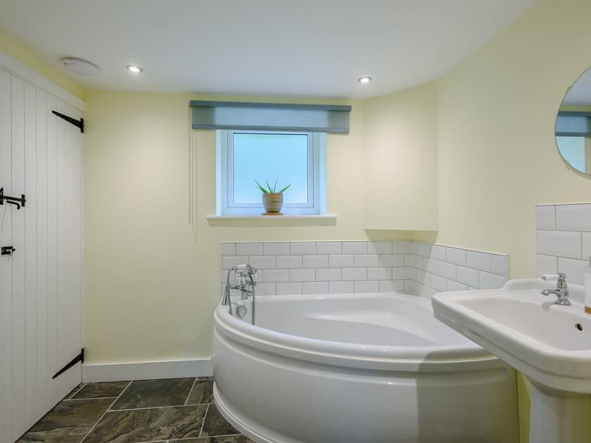 Bathroom with corner bath | Leatherpool Place, Wiveton, near Holt