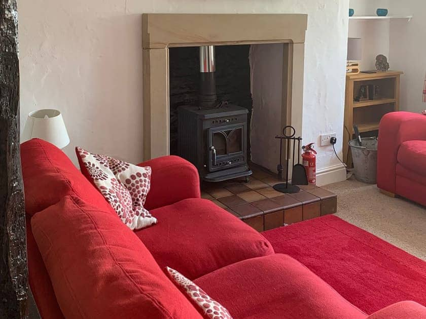 Cosy, beamed living room with wood burning stove | Rock Cottage, Crosthwaite