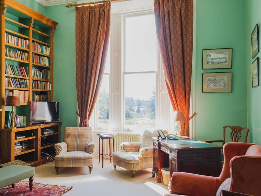 Characterful living room with open fire | Dalnaglar Castle - Dalnaglar Castle And Cottages, Glenshee, Cairngorms