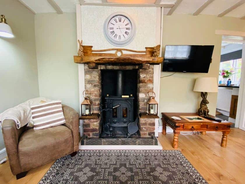 Welcoming living room with wood burner | The Old Toll House, Coalport, near Ironbridge