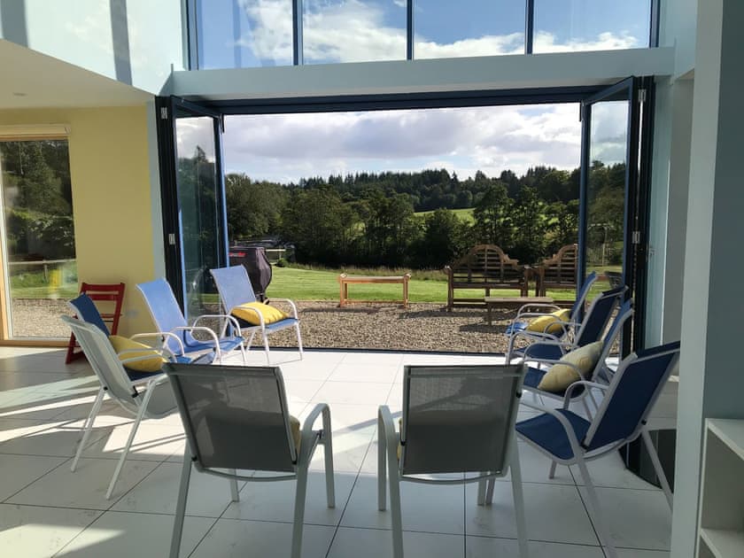 Bi-fold doors open onto the patio | Wester Auchleuchrie, Memus, near Kirriemuir