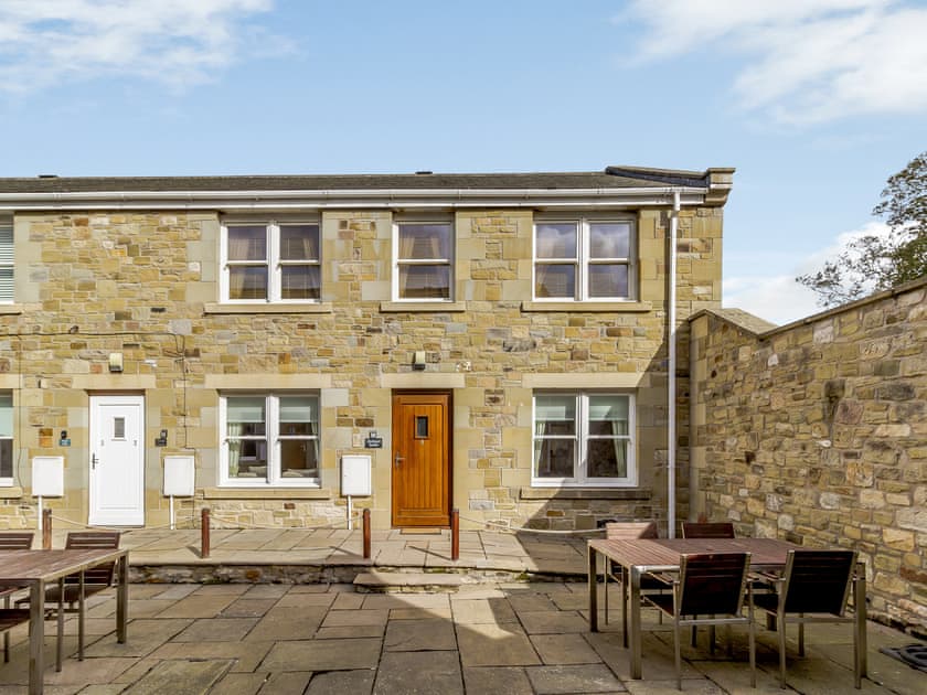 Paved patio area with outdoor furniture | Orchard Sands, Beadnell