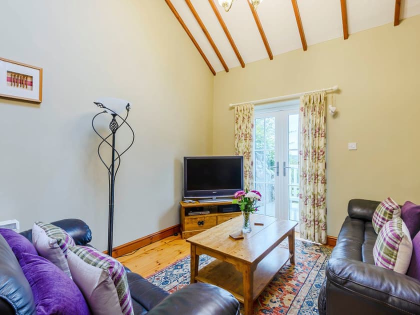 Living area | Ysgubor - Rhyddallt Ganol Cottages, Caethro, near Caernarfon