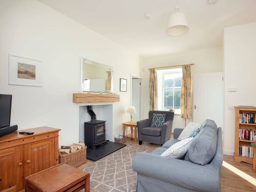 Welcoming living room | Nettlebush Cottage - Drumelzier Place Farm, Drumelzier, near Peebles