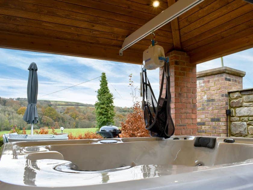 Hot tub with track hoist | Coria Lodge - Vindomora Lodges, Ebchester