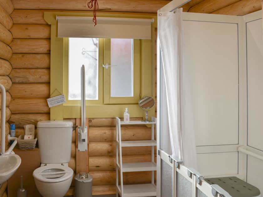 Shower room with walk-in shower, includes fold away seat and space suitable for a wheelchair to enter | Coria Lodge - Vindomora Lodges, Ebchester, near Consett