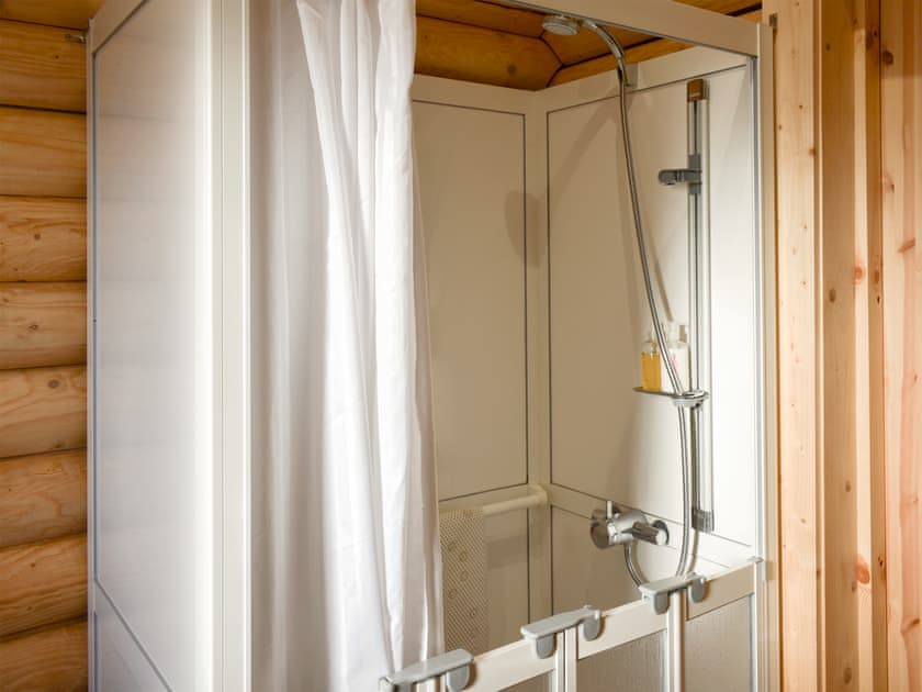 Shower room with walk-in shower, includes fold away seat and space suitable for a wheelchair to enter | Coria Lodge - Vindomora Lodges, Ebchester, near Consett