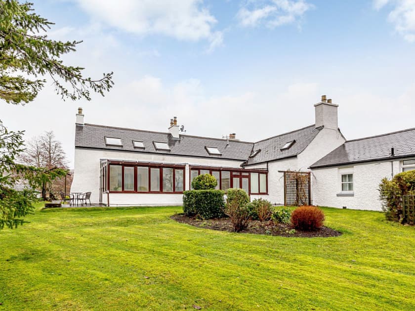 Attractive holiday home with large garden area | The Garden Wing - Kiltaraglen Cottages, Portree