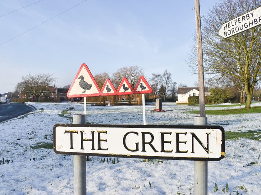 Picturesque Tolthorpe village green in the snow