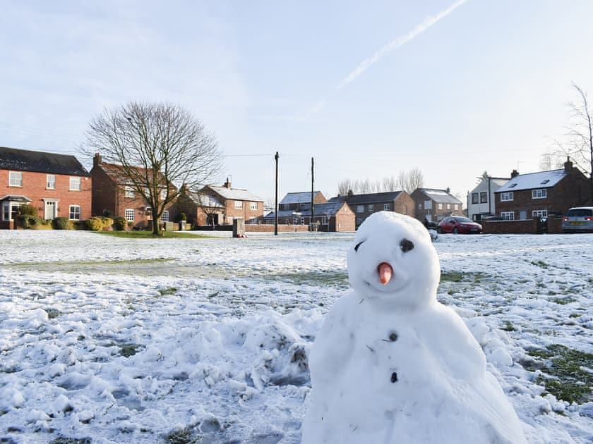 Picturesque Tolthorpe village green in the snow