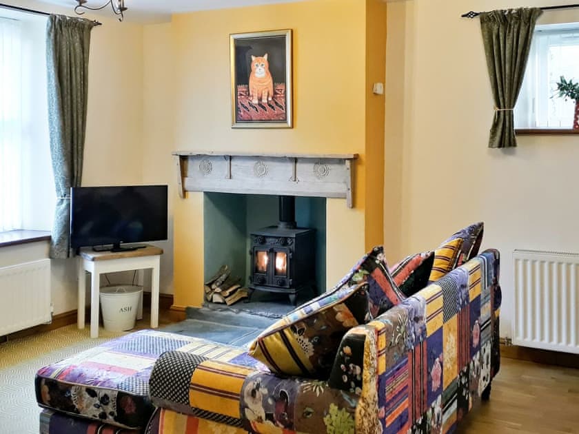 Warm and welcoming open plan living area | Skelmorlie Cottage, Portinscale, near Keswick