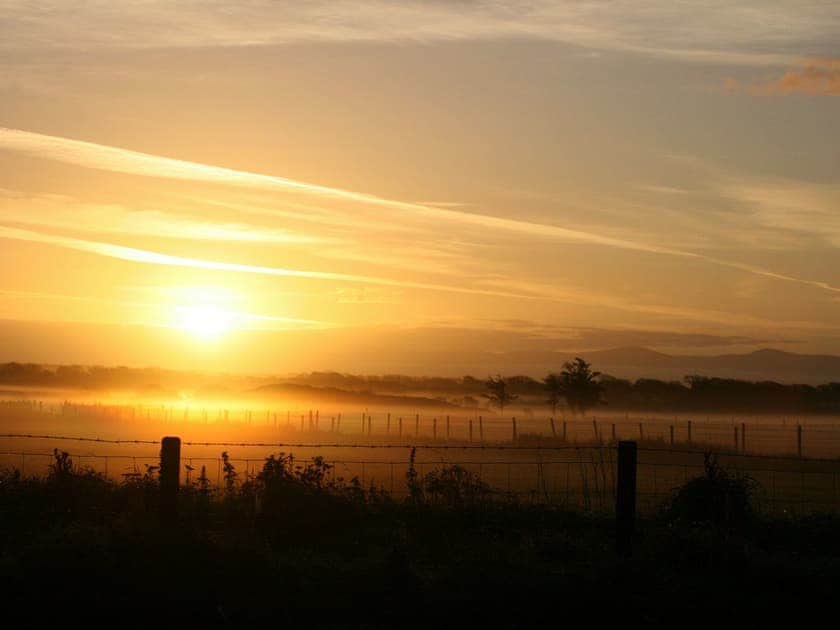 Sunrise over the meadow at Cerrig Cottages | Lapwing Cottage, Curlew Cottage - Cerrig Cottages, Caergeiliog, near Rhosneigr