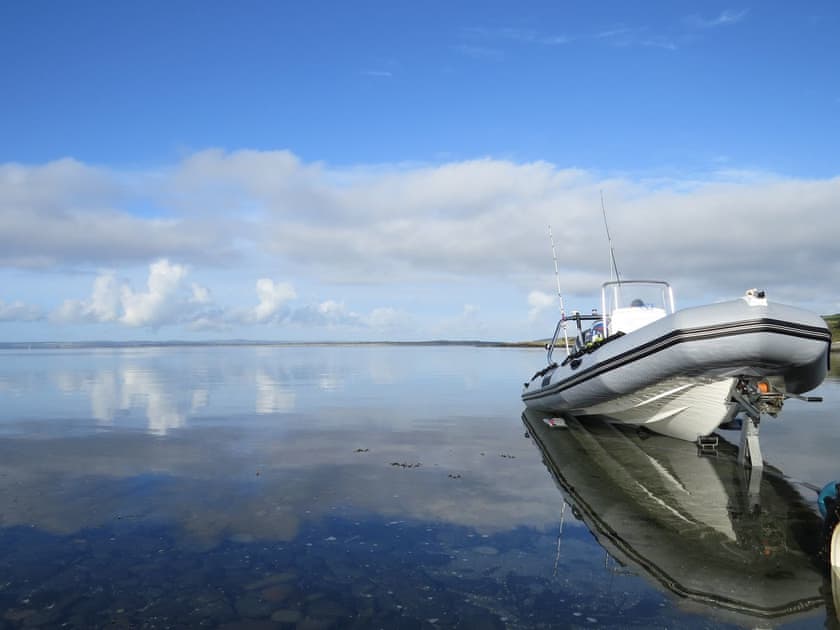 Launching a boat from the slipway | Fisherman’s Cottage, Stairhaven by Glenluce