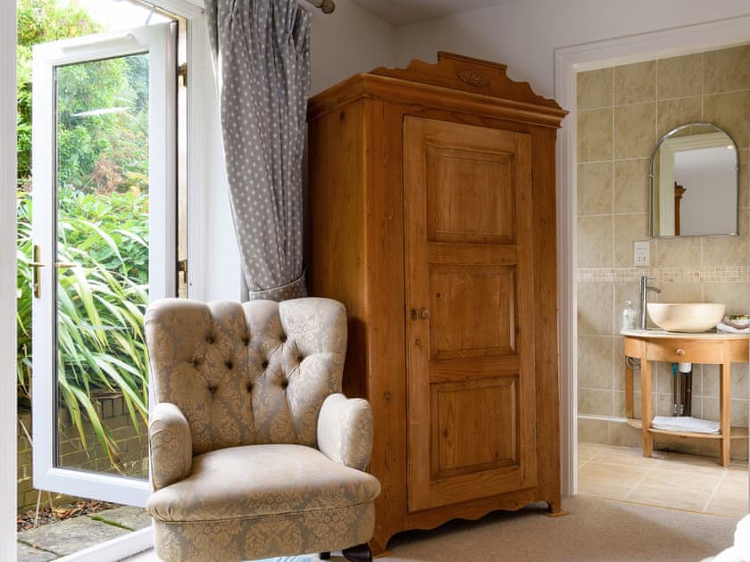 Four Poster bedroom | Treetops, Arthog, near Dolgellau