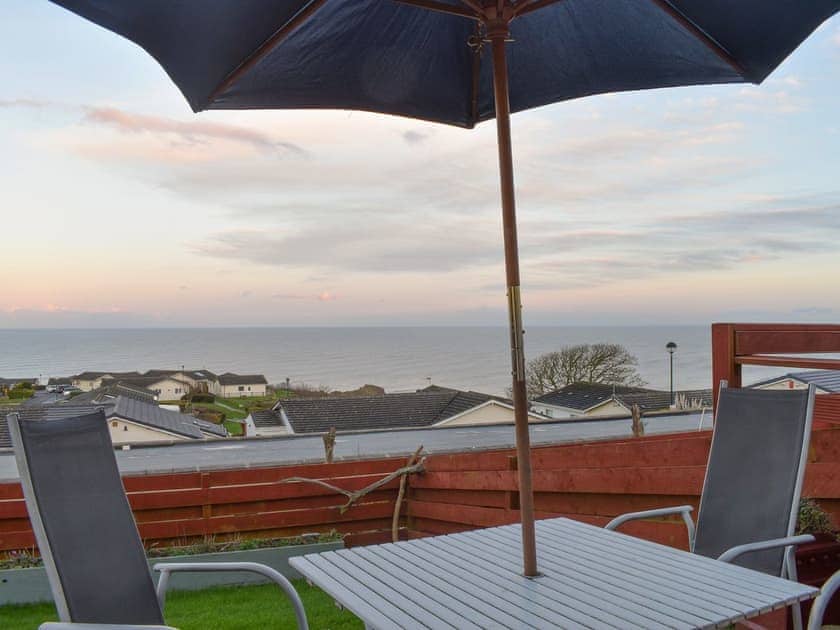 Sitting-out-area | Sea Views Three - 38 - Sea View Cottages, Knipe Point, near Cayton