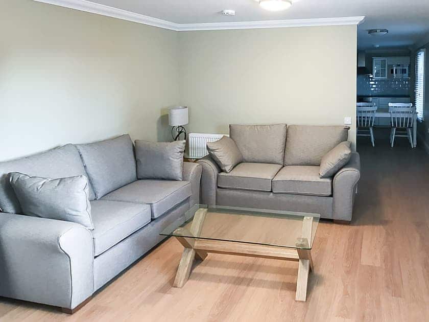 Living room through to the dining area and kitchen | Allt-Nan-Ros Cottage - Allt-Nan-Ros Apartments, Onich, near Fort William