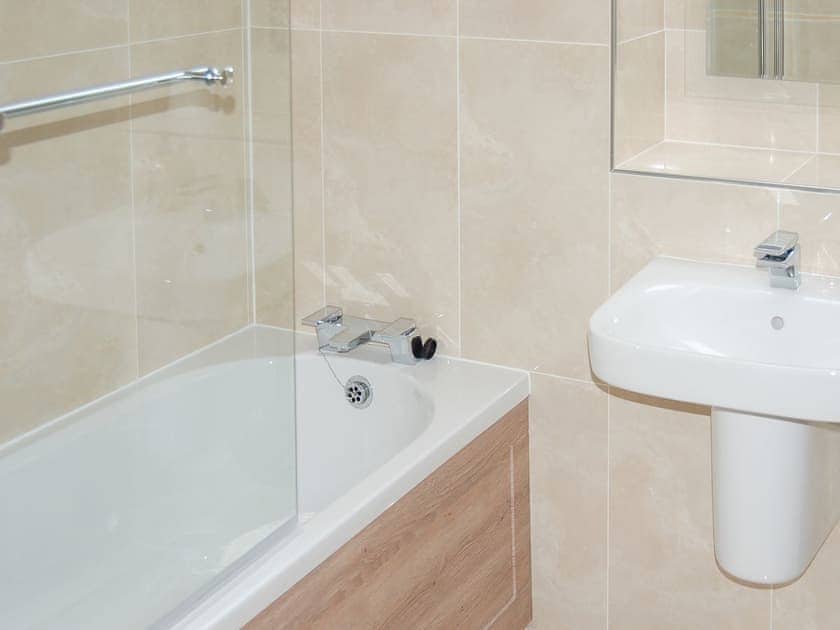 Bathroom with shower over the bath | The Stables Cottage - Allt-Nan-Ros Apartments, Onich, near Fort William