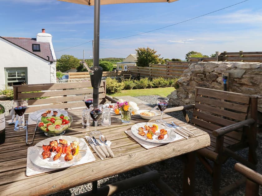 Top terrace dining/bbq area | Fferam Gorniog, Holyhead Mountain, near Trearddur Bay