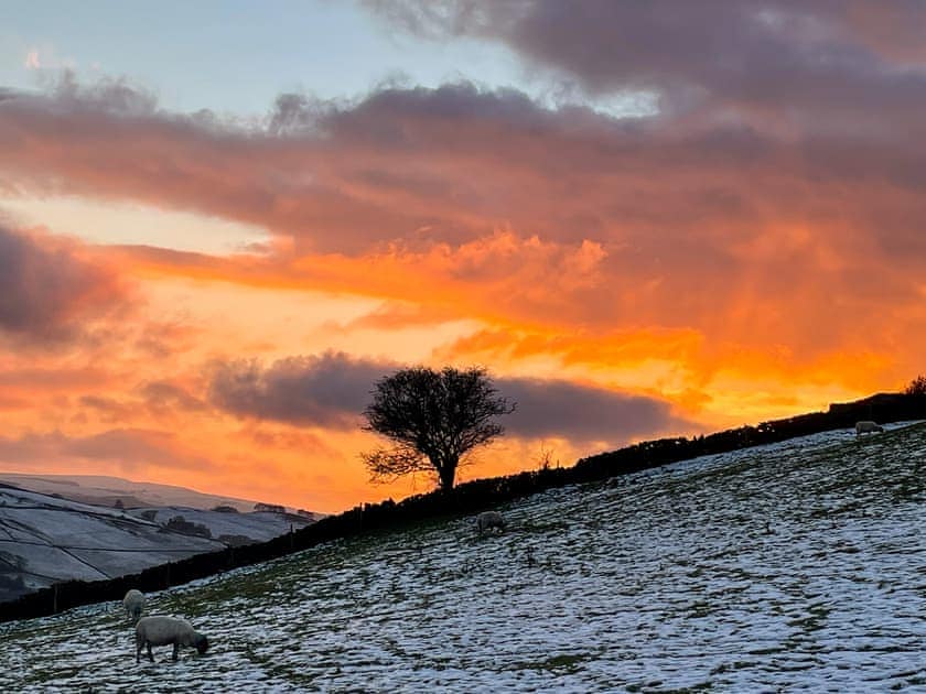 There can be some beautiful sunsets overlooking our back fields. Take a seat on the bench and enjoy the view just a few yards away from your door.  | Willow Cottage at Naze Farm, Sycamore Cottage at Naze Farm - Naze Farm, Chinley