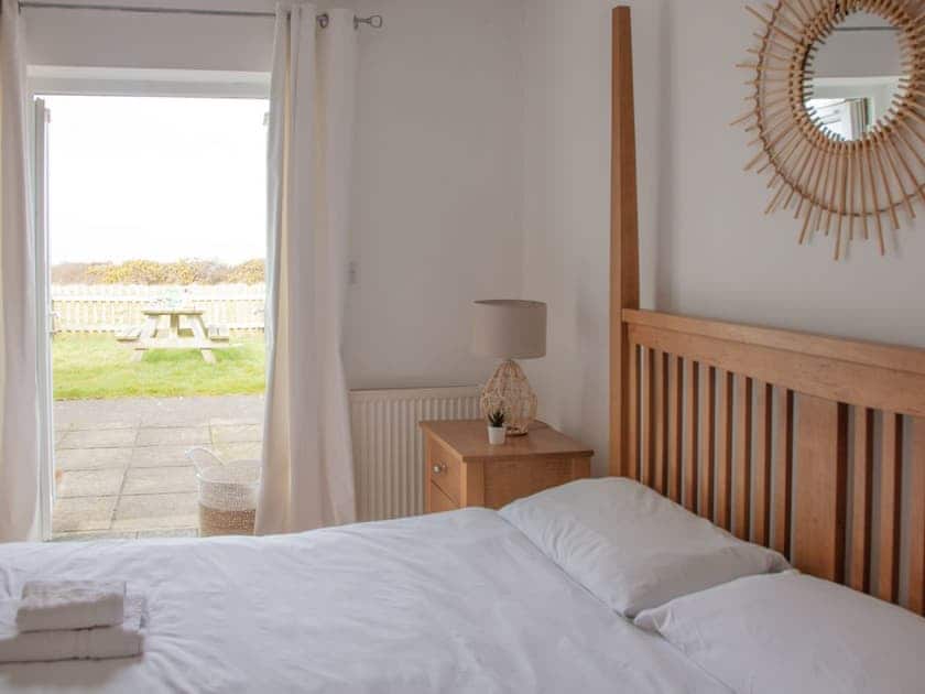 Master bedroom | The Mill - Bach Wen Cottages, Clynnog Fawr
