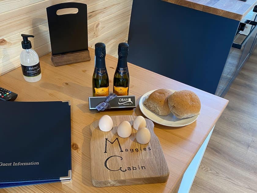 Locally Hand Made Chocolates from Oban Chocolate Co, 2 small bottles of Proseco, Mackies of Scotland Crisps, fresh free range eggs from our own Silkie Hens | Maggie’s Cabin, Oban