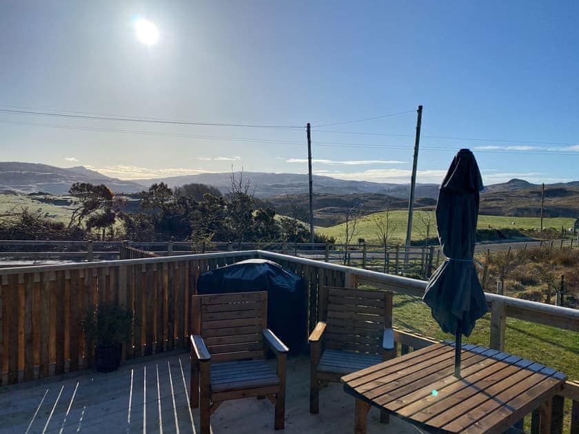 Large decked area to the front overlooking the surrounding fields and hills | Maggie’s Cabin, Oban