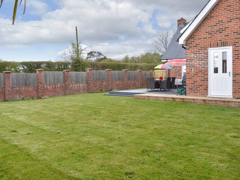 Garden | Groves Cottage - Devonia Holiday Homes, Newchurch, near Sandown