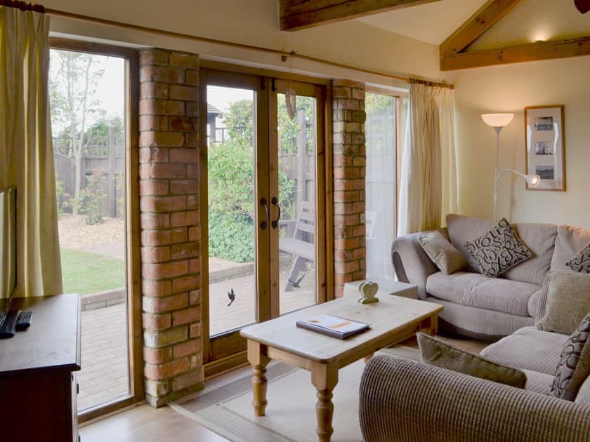 Living area | Sunflower Holiday Cottage, Thoresthorpe, near Alford