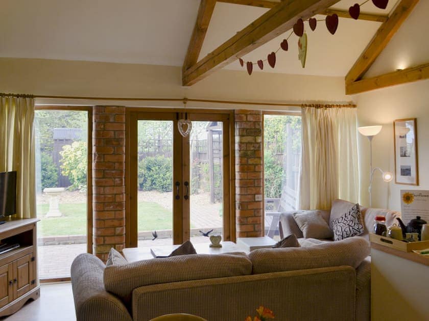 Living area | Sunflower Holiday Cottage, Thoresthorpe, near Alford