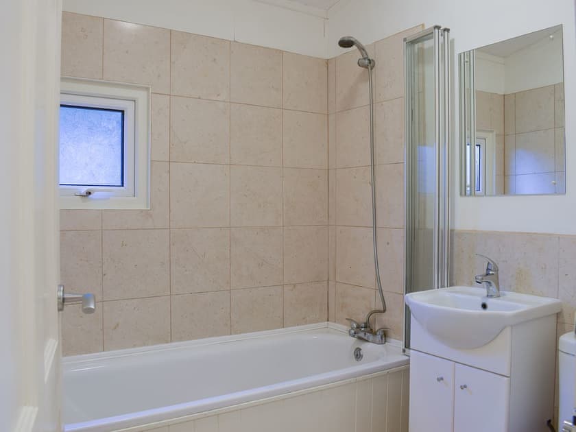 Bathroom with shower over the bath | Oak Haven, Cenarth, near Newcastle Emlyn