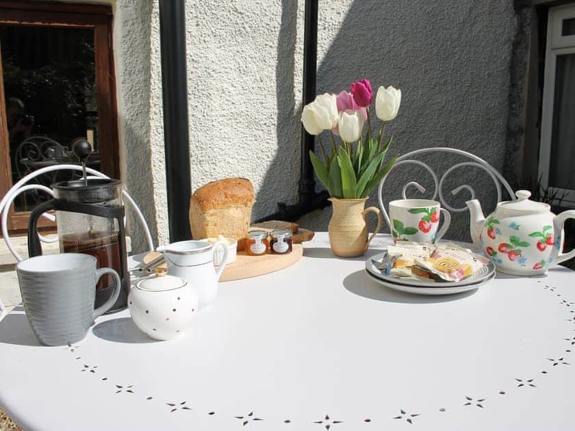 Great private courtyard with garden furniture | Bell Hill Cottage, Lindale, near Grange-over-Sands