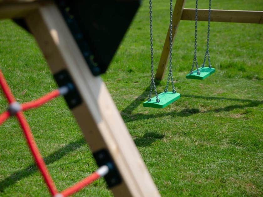 Children’s play area | The Coach House - Woodlands Manor Farm, Woodford, near Bude