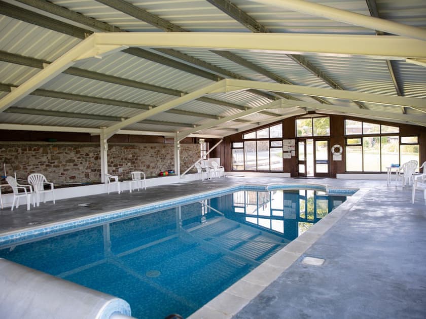 Swimming pool | Honeysuckle Cottage - Woodlands Manor Farm, Woodford, near Bude