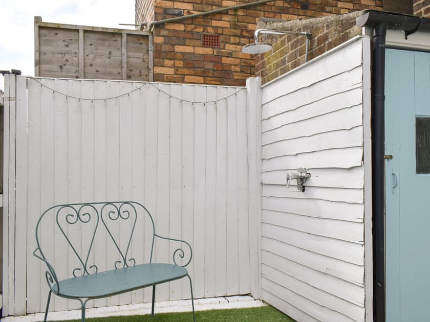 Outdoor shower within courtyard | Little Blue Seaside House, Scarborough