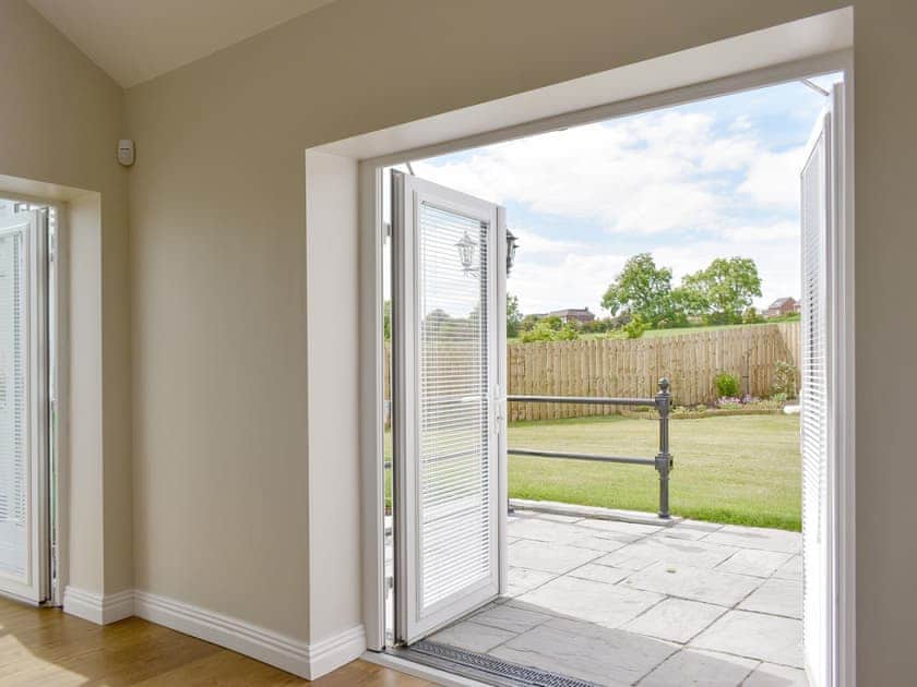 Living area with patio doors to rear garden  | Miners Meadow, Wheatley Hill, Durham