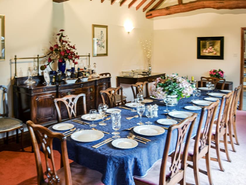 The dining room table will seat 12 and even 14 at a push, heated trolley and plenty of glasses to celebrate your occasion. | Lodge Farm Barn, South Walsham