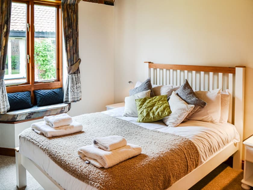 Walk-in wardrobe, bright room with views onto the courtyard, could this be Mrs White’s room. | Lodge Farm Barn, South Walsham