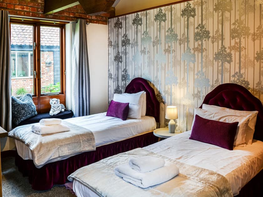 Lovely bright twin room and you’ve guessed it, Professor Plum has stayed here! | Lodge Farm Barn, South Walsham
