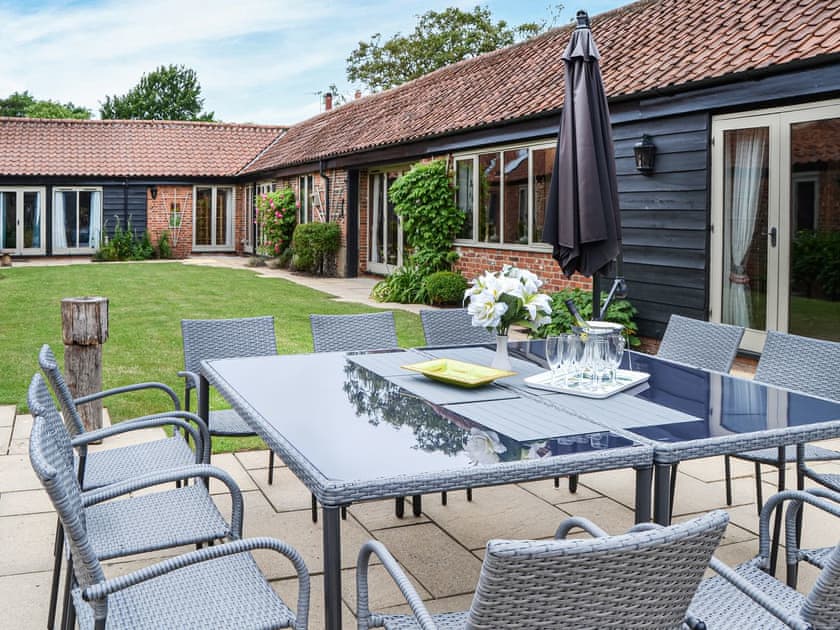 As well as the dining area which seats 12 we have now added a comfortable sitting out area | Lodge Farm Barn, South Walsham
