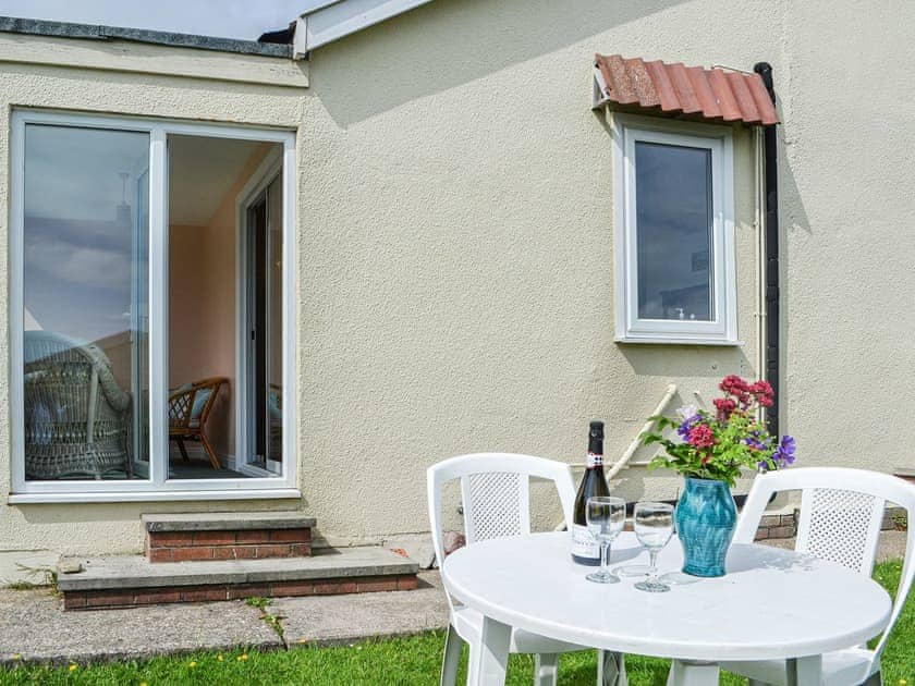 Sitting-out-area | Sunny Bank - Hunmanby Gap Cottages, Hunmanby Gap, near Filey