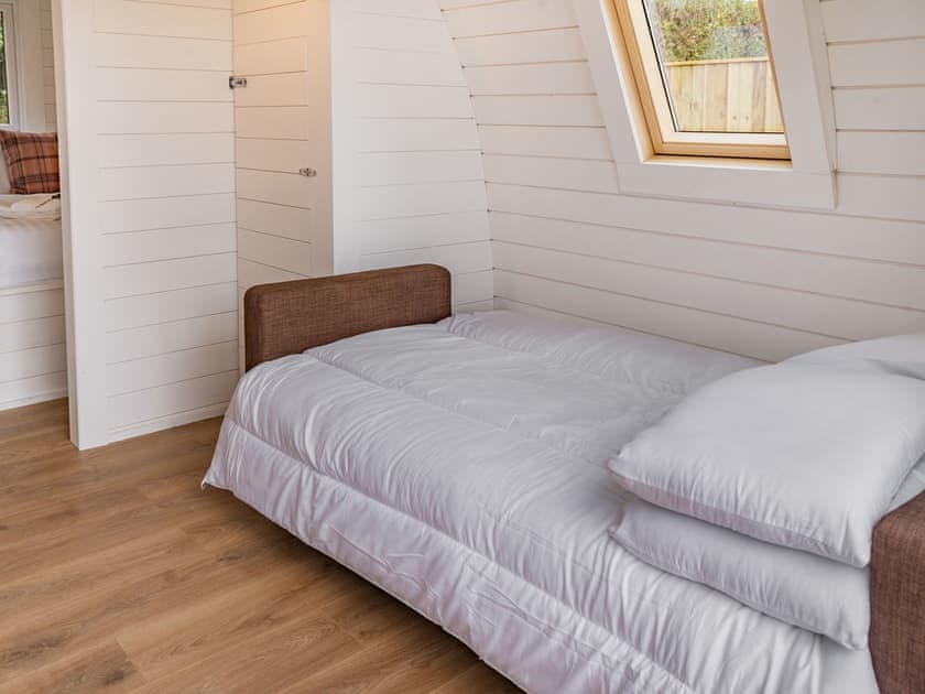 Living area converted to double bed sleeping area | Cwtch - Cwmporthman Farm, Blaenporth