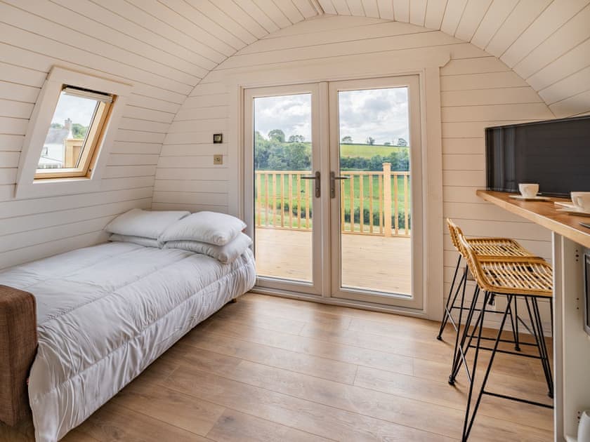 Living area converted to double bed sleeping area | Cwtch - Cwmporthman Farm, Blaenporth