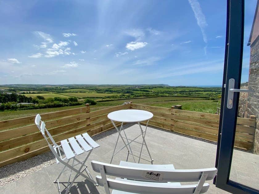 Decked patio | Woolbarn - Wooldown Holiday Cottages, Marhamchurch, near Bude