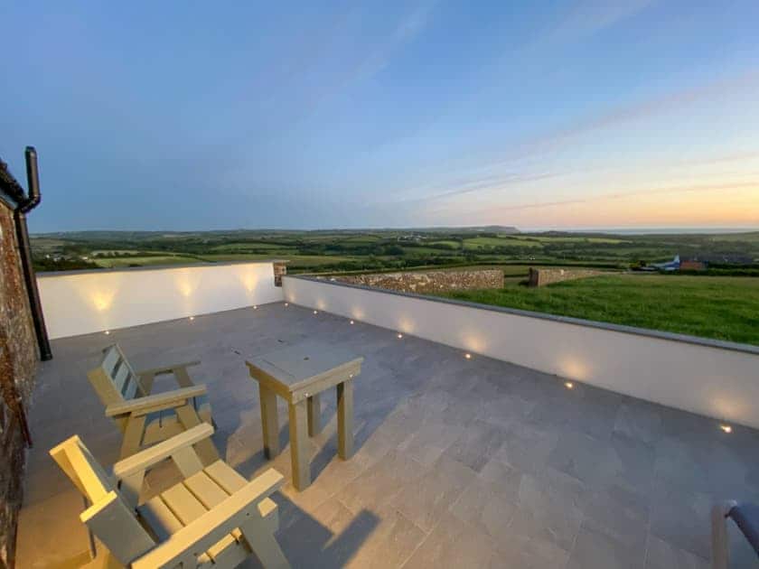 Sitting-out-area | Woolbarn - Wooldown Holiday Cottages, Marhamchurch, near Bude