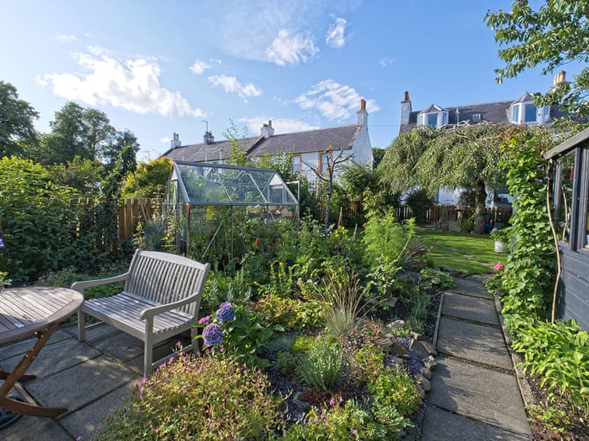 Private patio and seating area to enjoy the garden. | Lower Canterbury House, Gattonside, near Melrose