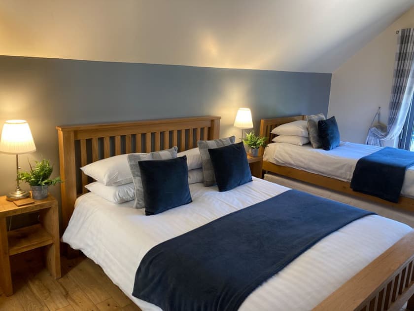 Balconied bedroom with double and single beds | Redroofs Barn, Weston, near Newark
