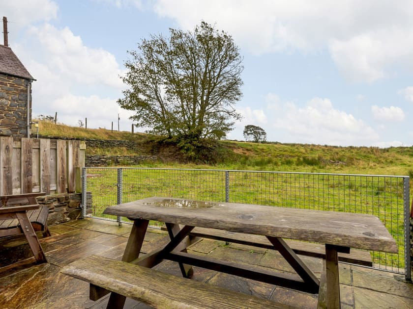 Sitting-out area | Robin’s Nest - Paith Holiday Cottages, Capel Seion, near Aberystwyth