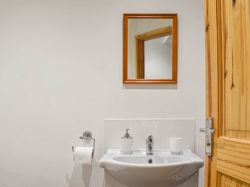 Bathroom with shower cubicle toilet and basin | The Barnsdale, Amlwch