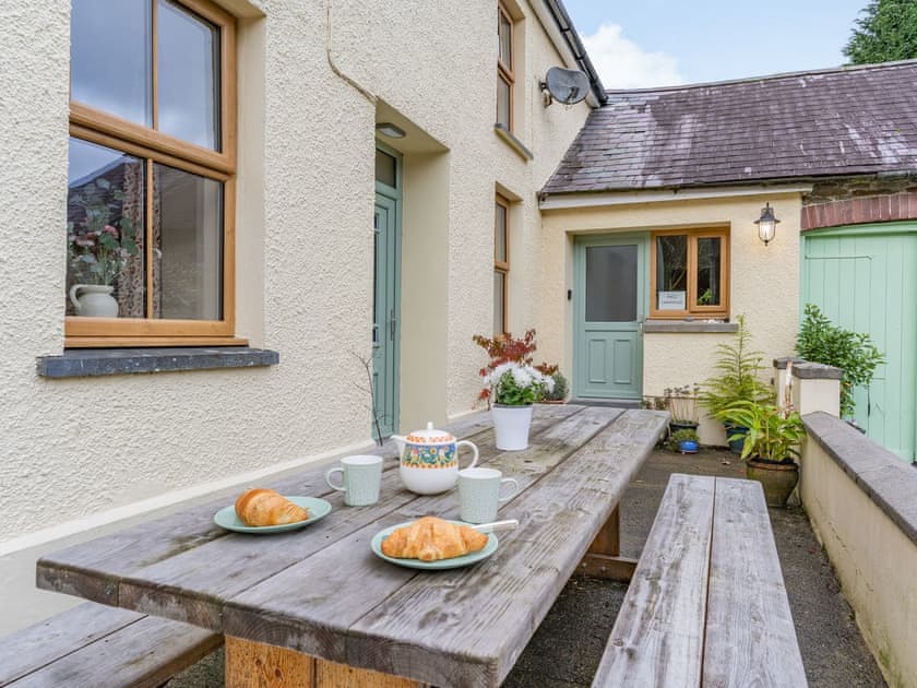 Outdoor eating area | Pwll Farmhouse, Llanllawddog, near Brechfa