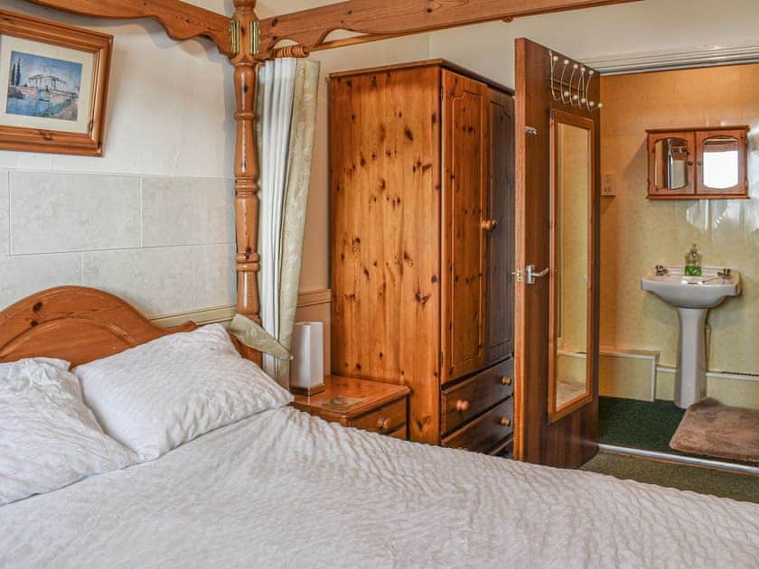 Four Poster bedroom | King Arthur Suite, Trearddur Bay